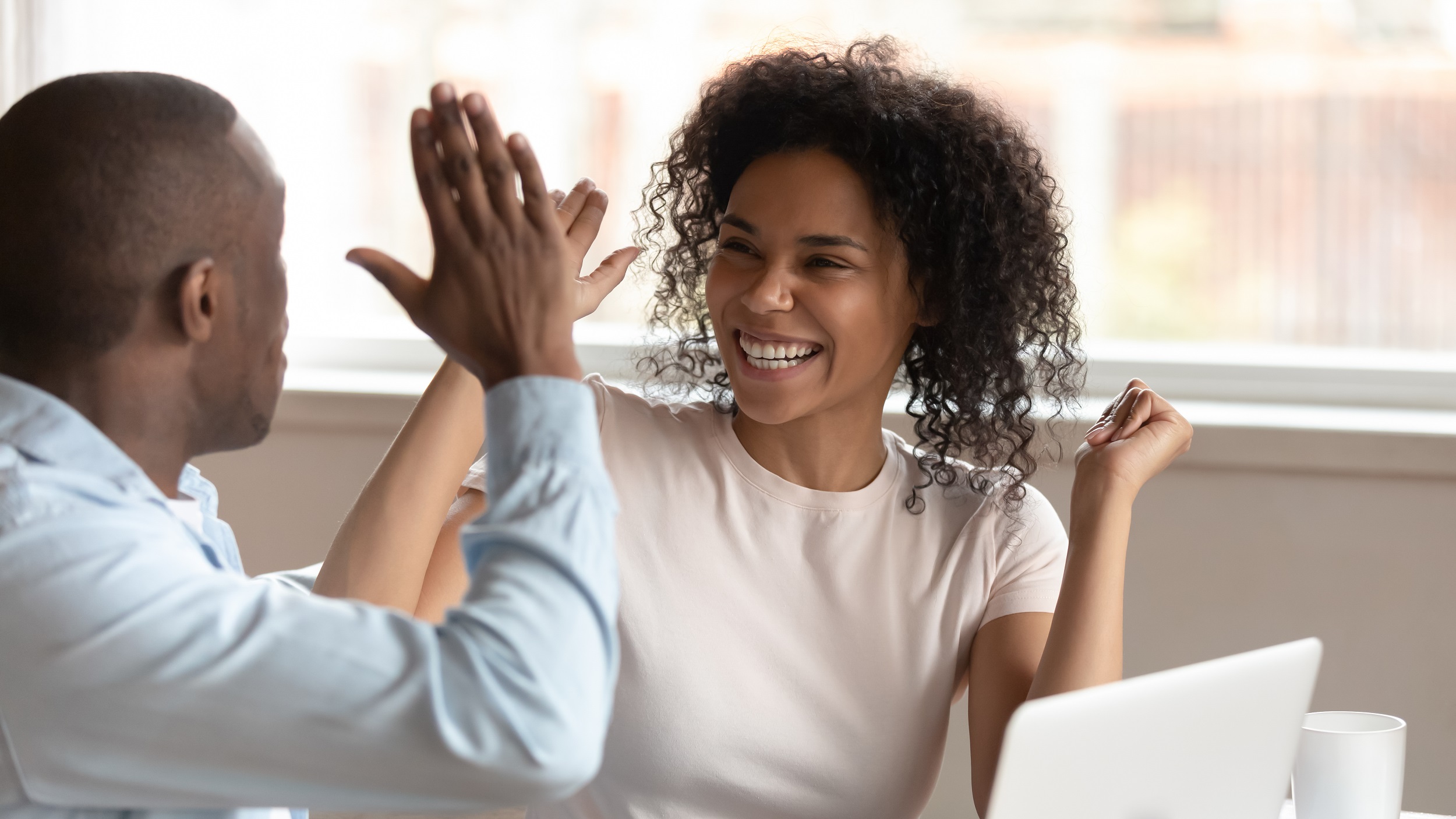 Woman and man high five